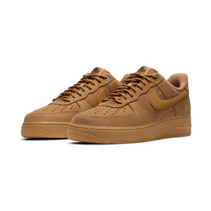 A pair of Nike Air Force 1 '07 WB men's shoes in brown color, featuring a low-top design, lace-up closure, and Nike logo on the side.