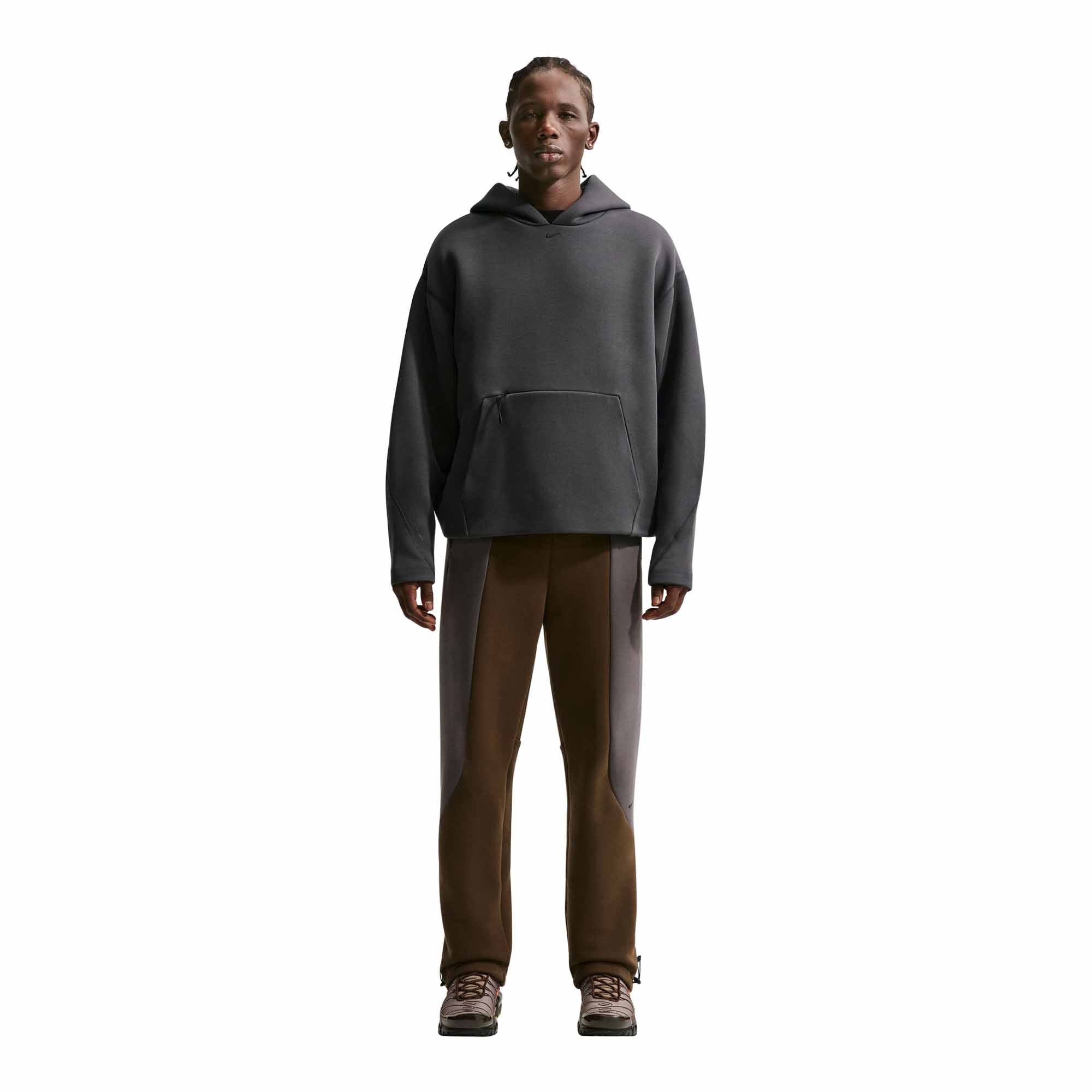 Anthracite Nike Tech IO9941 pullover worn with brown trousers.